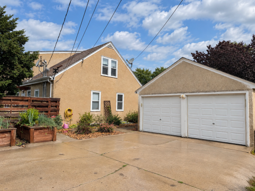 A place for cars, bikes, tools and seasonal gear. The detached garage offers useful storage, electric service and new door openers, with raised garden beds just outside for summer growing.