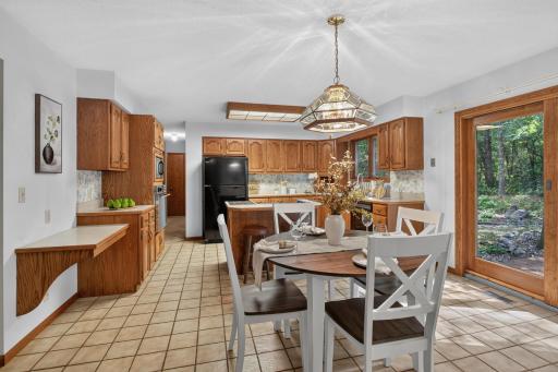 Main level: kitchen with tons of storage and eat-in dining area
