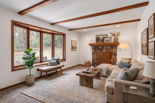 Main level: 2nd living room with fireplace (complete with custom fireplace cover) virtually staged