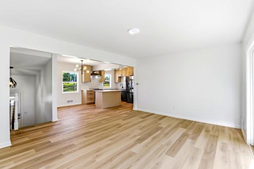 The open-concept floor plan flows seamlessly from the beautifully renovated kitchen into the next space, creating a bright and inviting home ideal for relaxing, gathering, and entertaining.