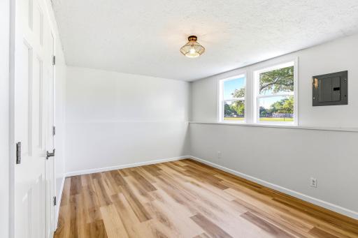Multiple windows bring in natural light, creating a comfortable and welcoming retreat.