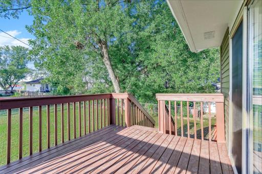 Step directly from the living room onto the raised backyard deck ,a wonderful extension of the home for grilling, entertaining, or enjoying peaceful mornings outdoors.
