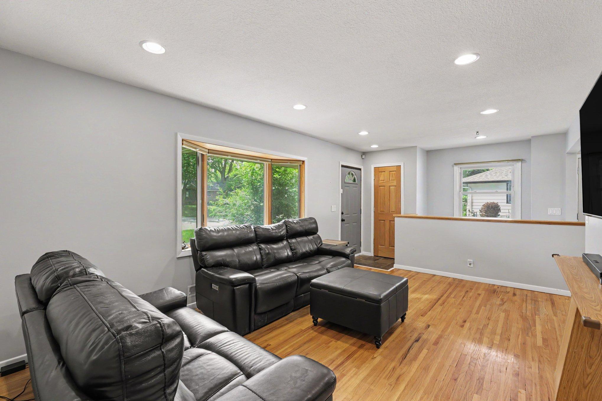 Another view of the living room. The home features 6-panel wood doors and was freshly painted throughout - 2024.