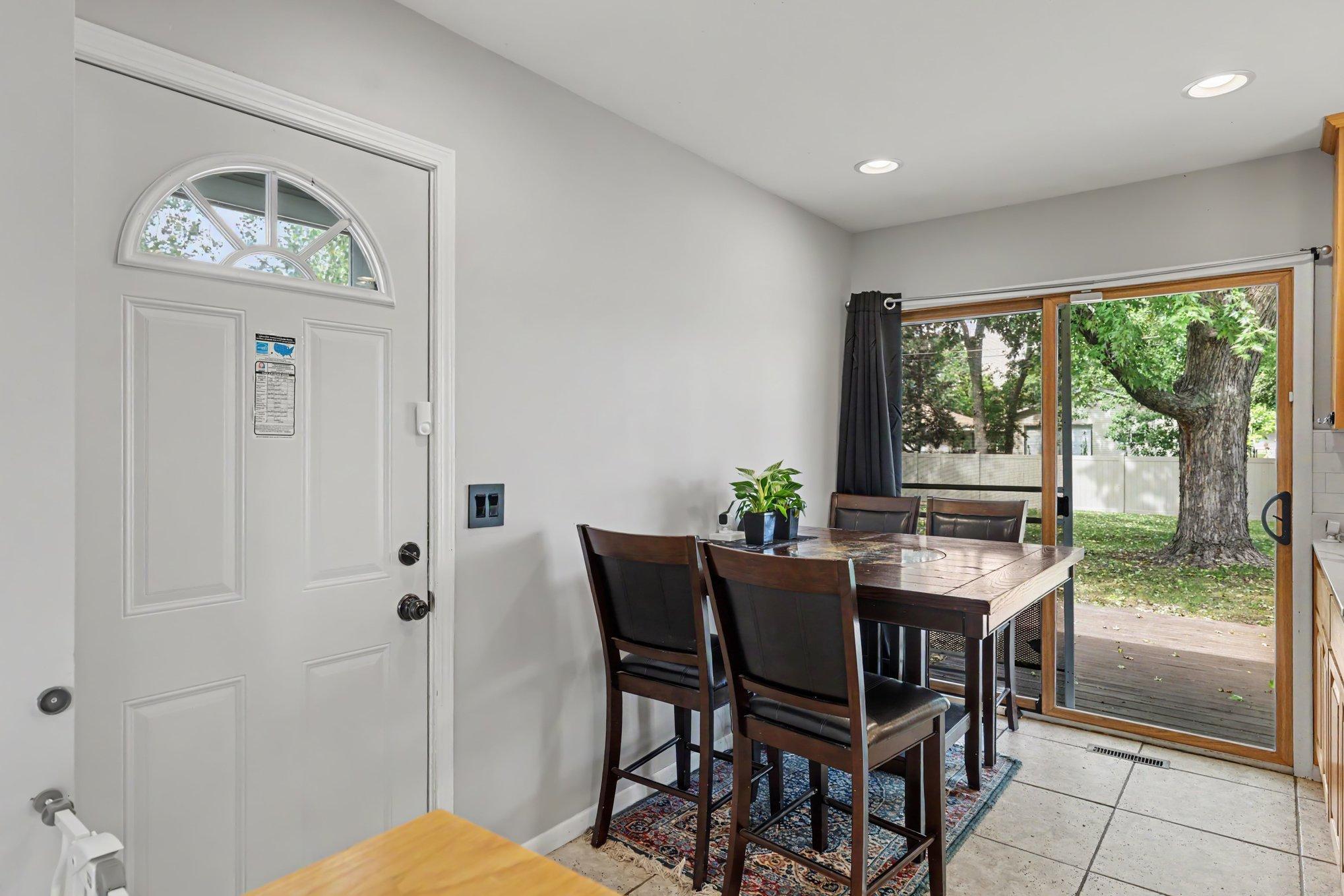 The informal dining room conveniently leads to the backyard deck and yard.