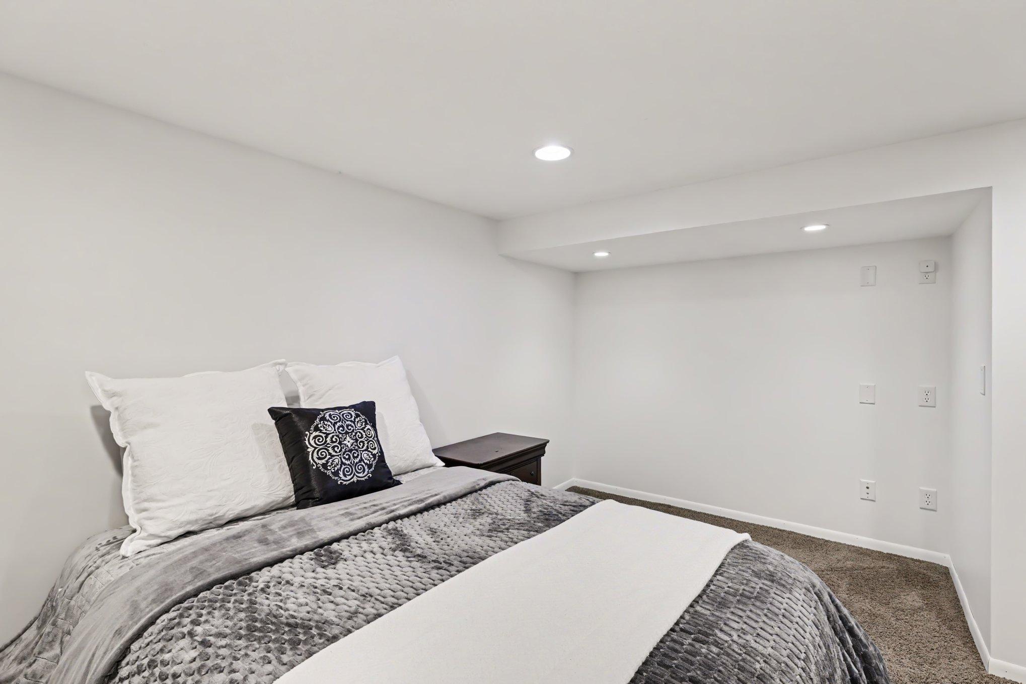 Another view of the lower-level third bedroom.