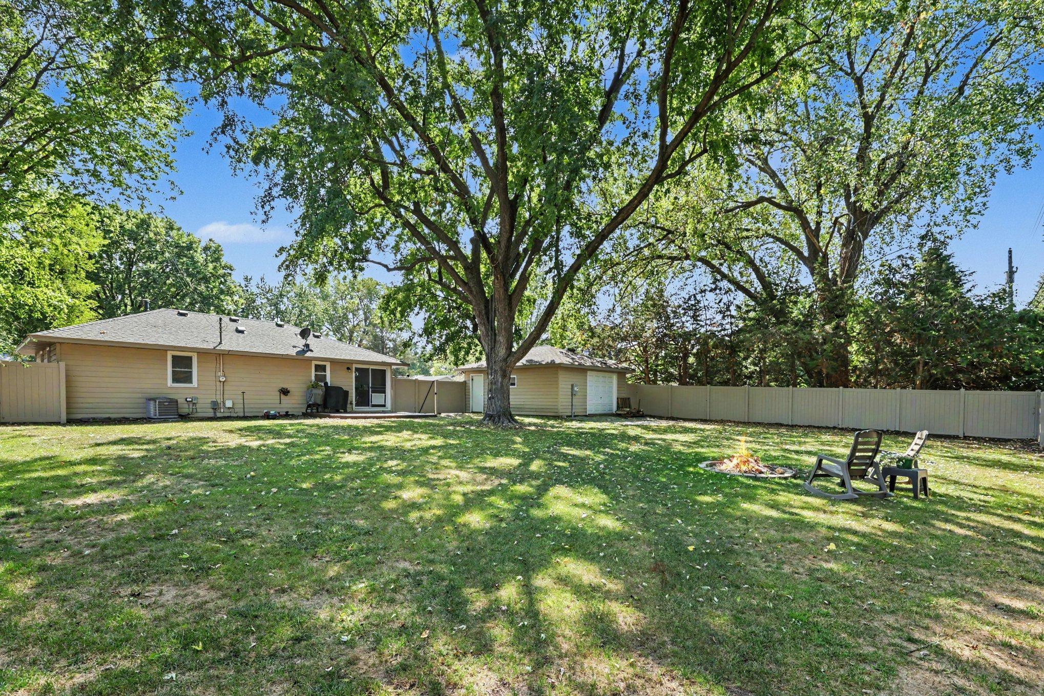 A view of the large, flat backyard.