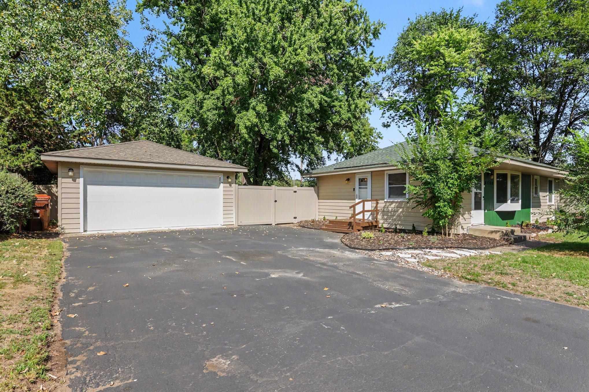 The two car garage includes an electric vehicle charger, a smart garage door opener & a pull through garage door to the backyard. The driveway was resealed in 2026.