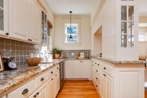 Easy access to the walk-in pantry with wet bar and beverage fridge.