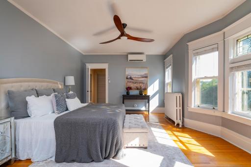 The sprawling primary suite features an attached bedroom!