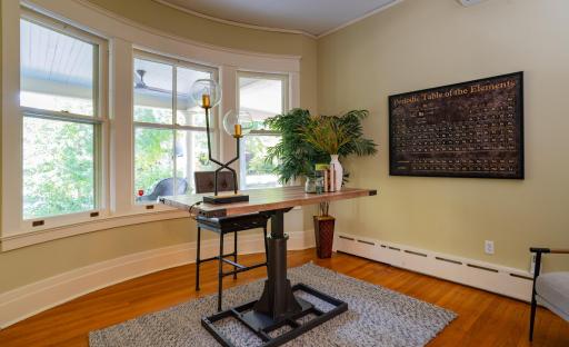 A main floor den is a great spot to tuck away a television or create a cozy conversation space.