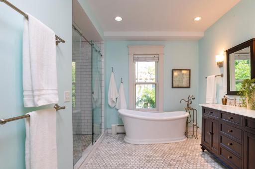 Separate soaking tub and huge, walk-in shower.