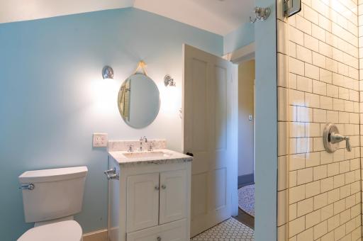 The third floor bathroom remodel converted an old tub to a convenient walk-in shower.