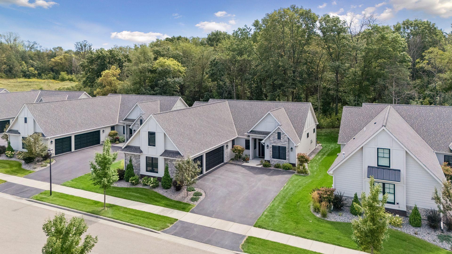Beautiful aerial view showcasing the home and its peaceful setting, with mature trees creating a gorgeous backdrop.
