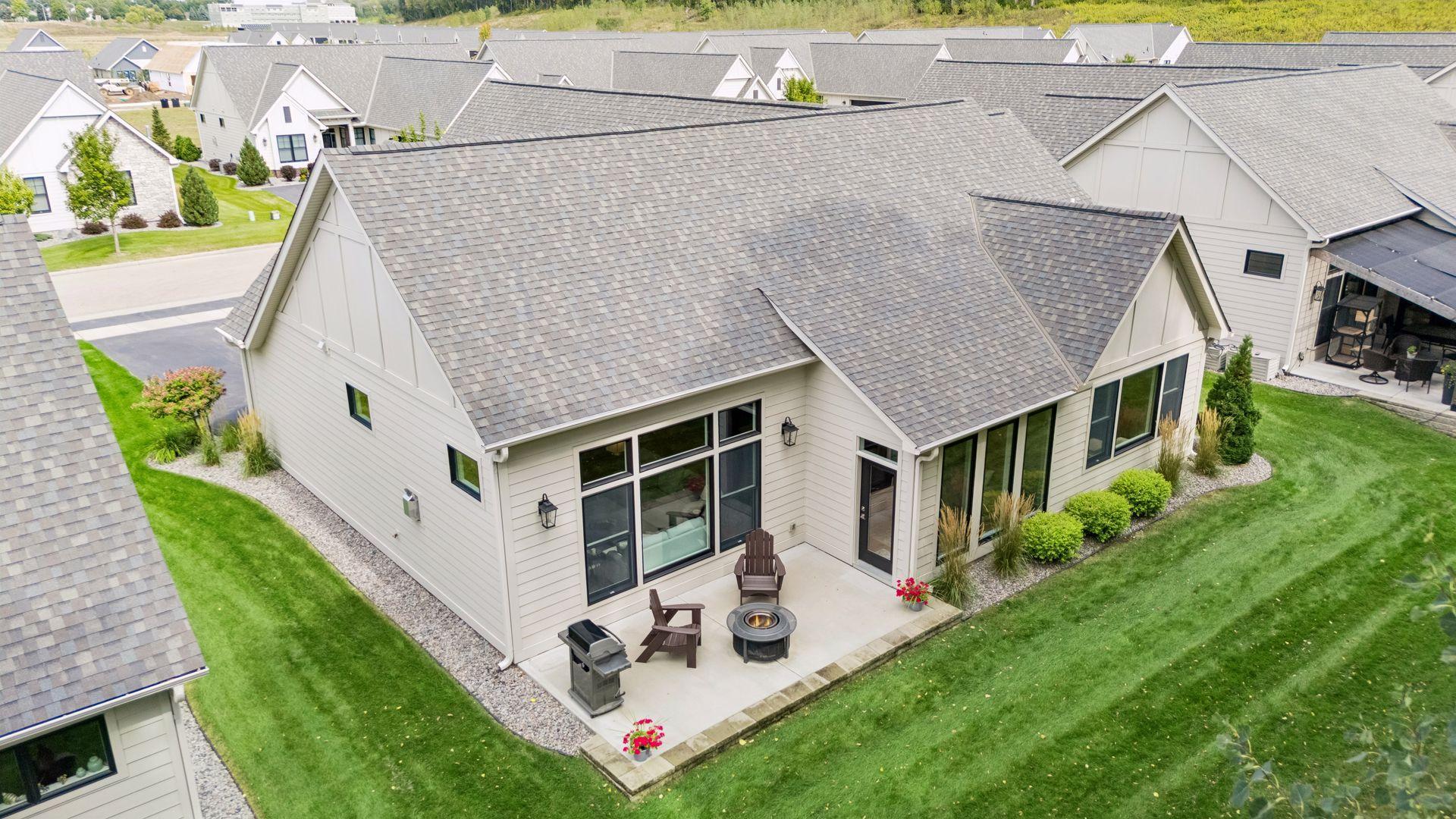 The large backyard patio offers plenty of room to entertain, dine outdoors, or simply relax and enjoy the peaceful surroundings.