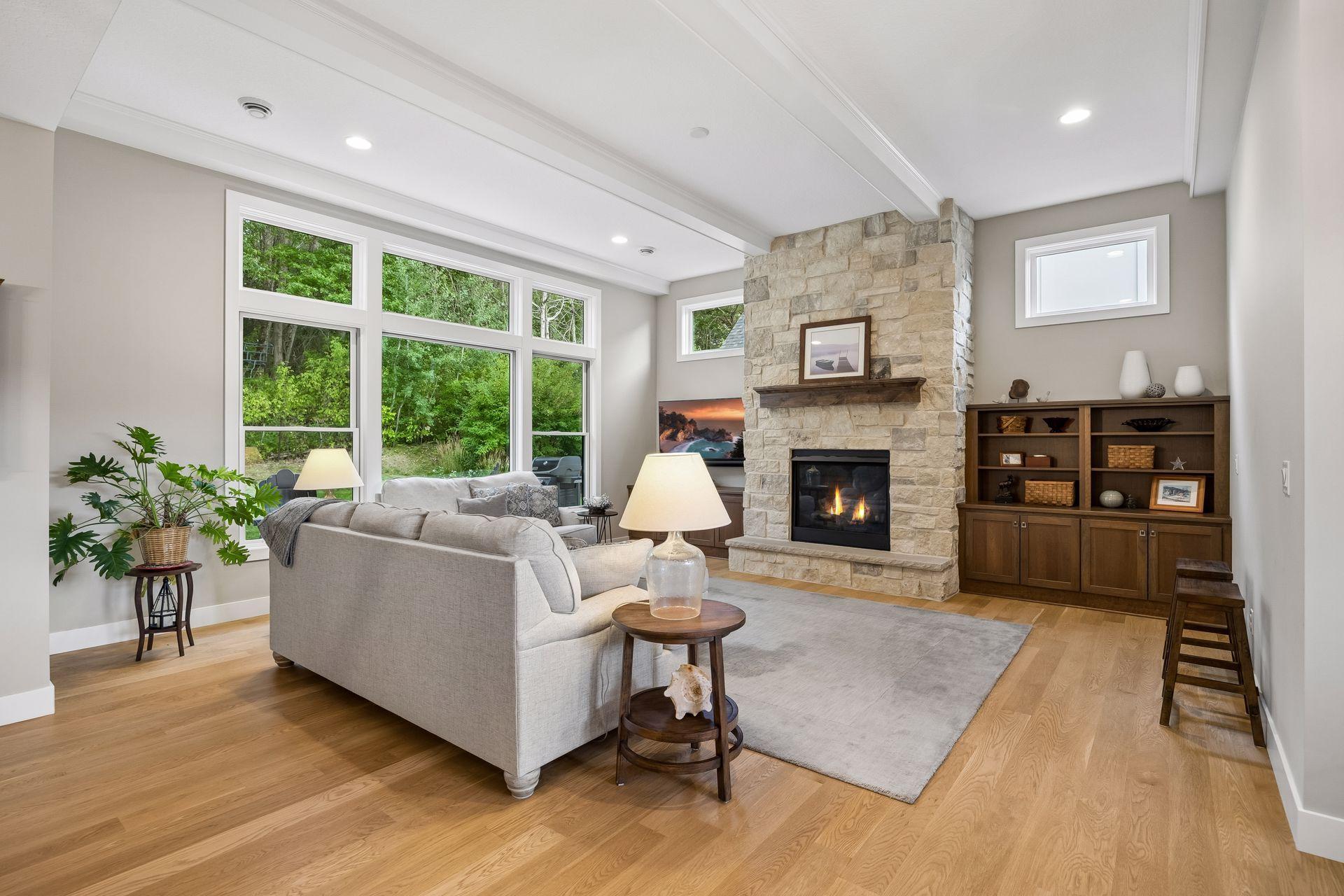 Custom built-in cabinetry, thoughtfully placed windows, and an incredible wall of glass bring so much natural light into the great room.