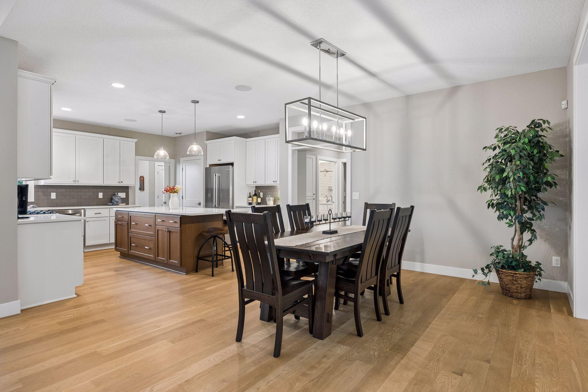 A generously sized dining area with plenty of room for a large table, complemented by the home's beautiful cabinetry and finish selections.