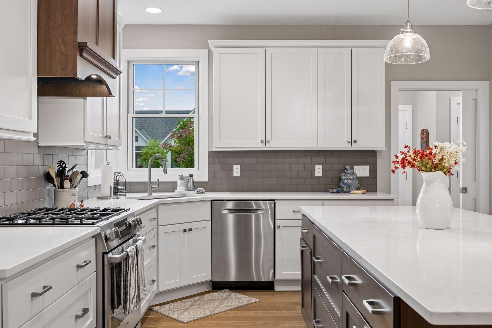 Wide walkways and 12' ceilings make the kitchen feel incredibly open and spacious, while a full suite of Bosch appliances adds to the thoughtful upgrades.