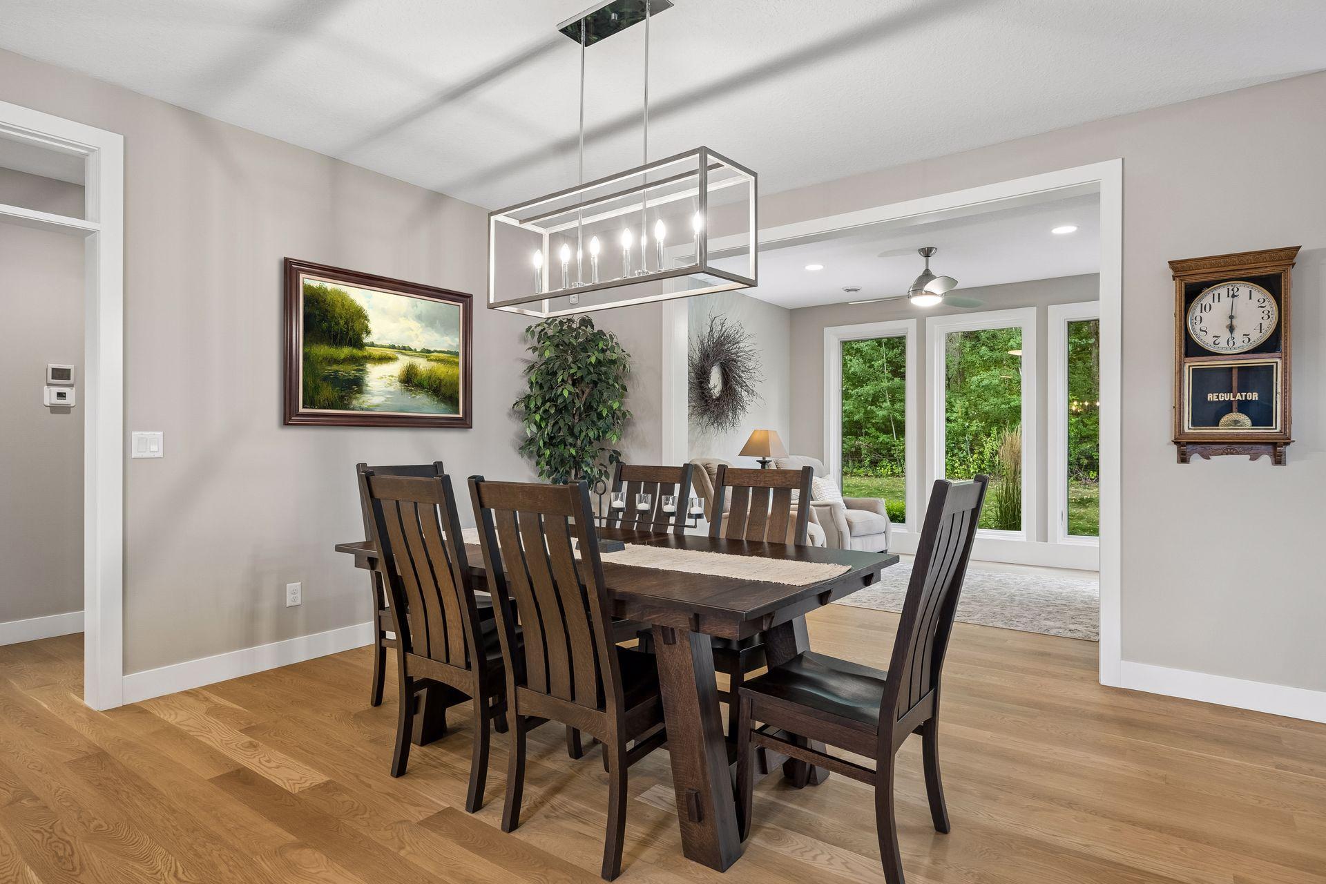 Just off the dining area, the four-season sunroom provides another inviting space to relax and enjoy the peaceful setting year-round.