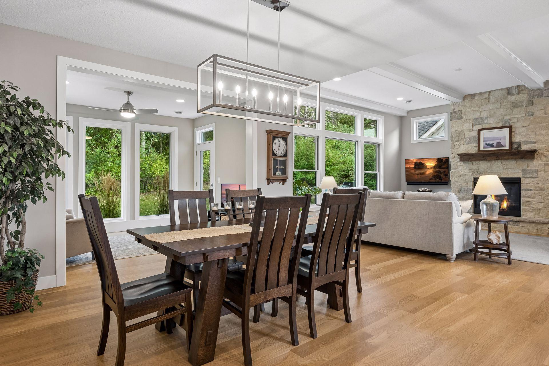 This view really showcases the home's open layout, connecting the kitchen, dining area, sunroom, and great room into one incredible main living space.