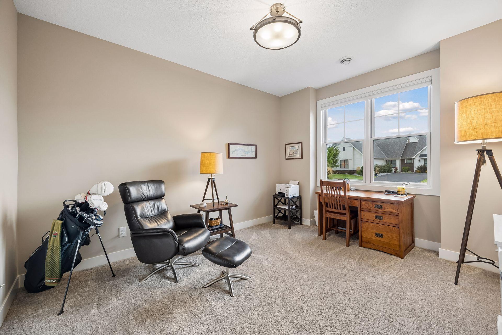 The front main-level bedroom is currently being used as a home office, showcasing the flexibility of this space.