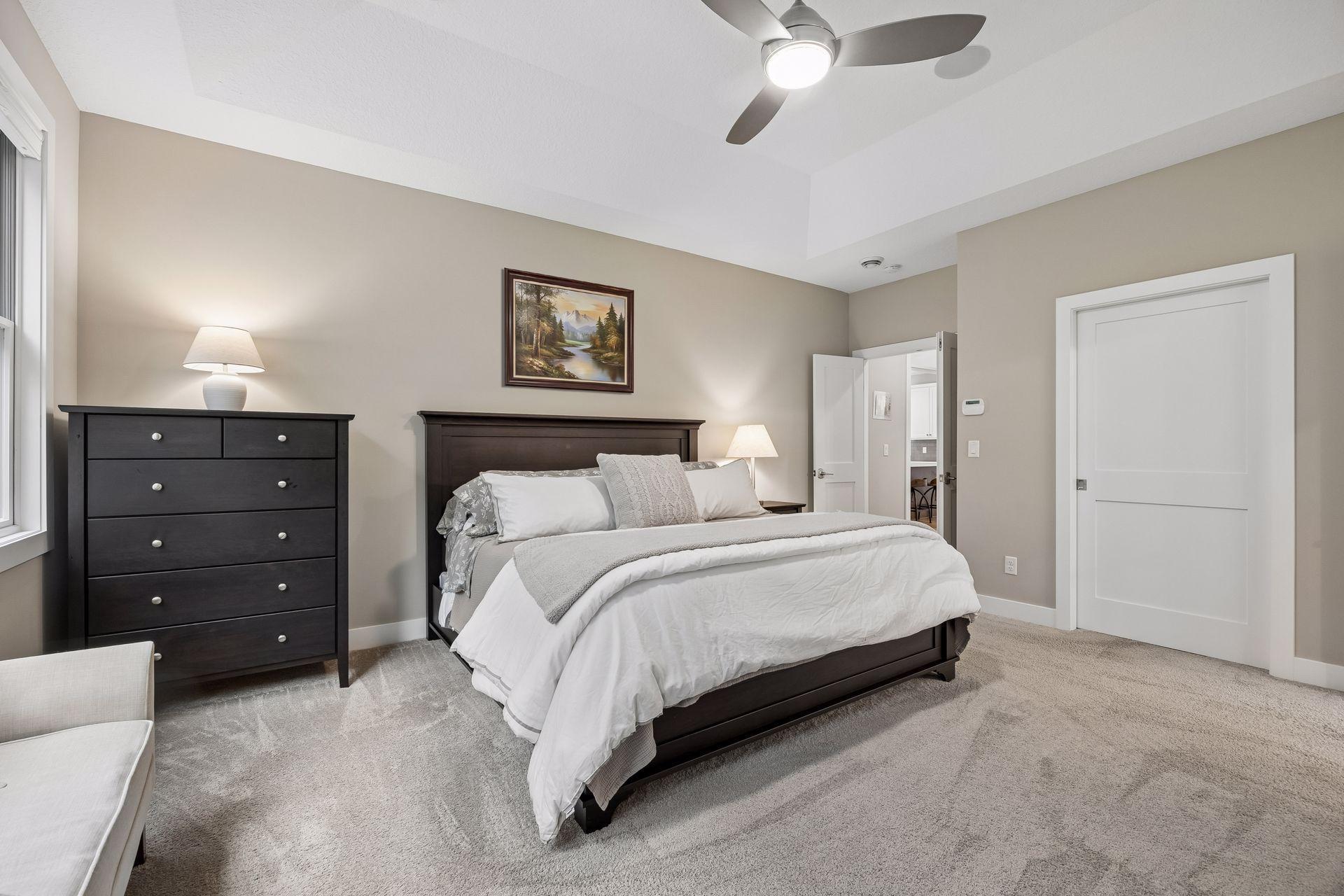 French doors create a beautiful entrance into the primary suite, adding another special detail to the space.