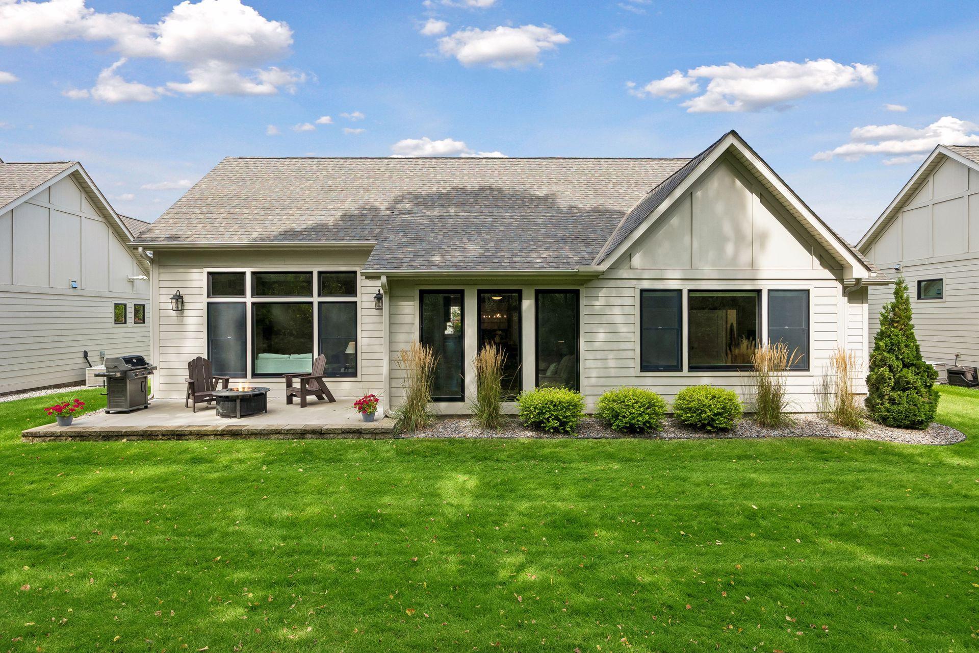 The backyard is beautifully landscaped, while an abundance of windows brings natural light and views of the outdoors into the home.