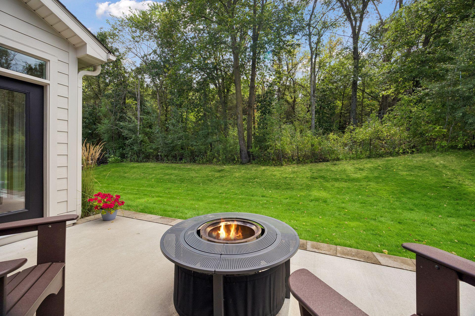 Imagine relaxing on the patio surrounded by mature trees and beautiful landscaping—a peaceful spot to unwind at the end of the day.