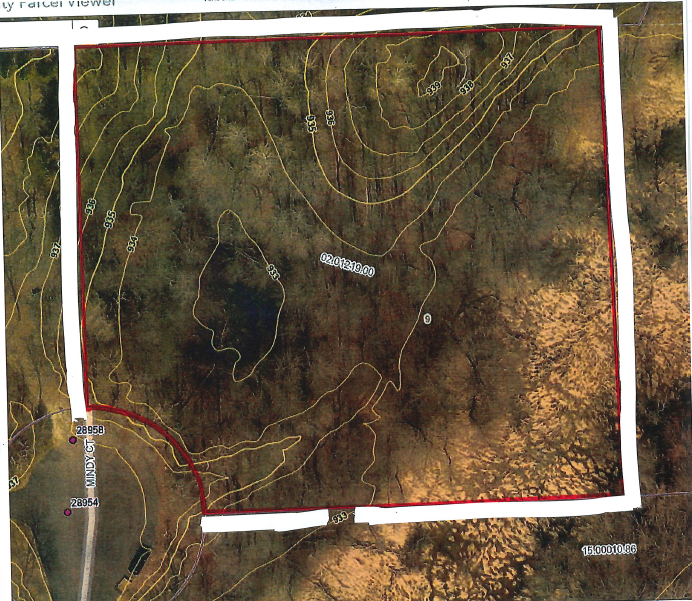 Gently sloping lot with lower portion in the center of the lot. Wet lands in SE corner.
