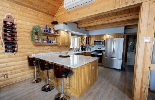 PHoto 2 - Updated kitchen with oversized quartz island, stainless steel appliances, gas stove.jpeg