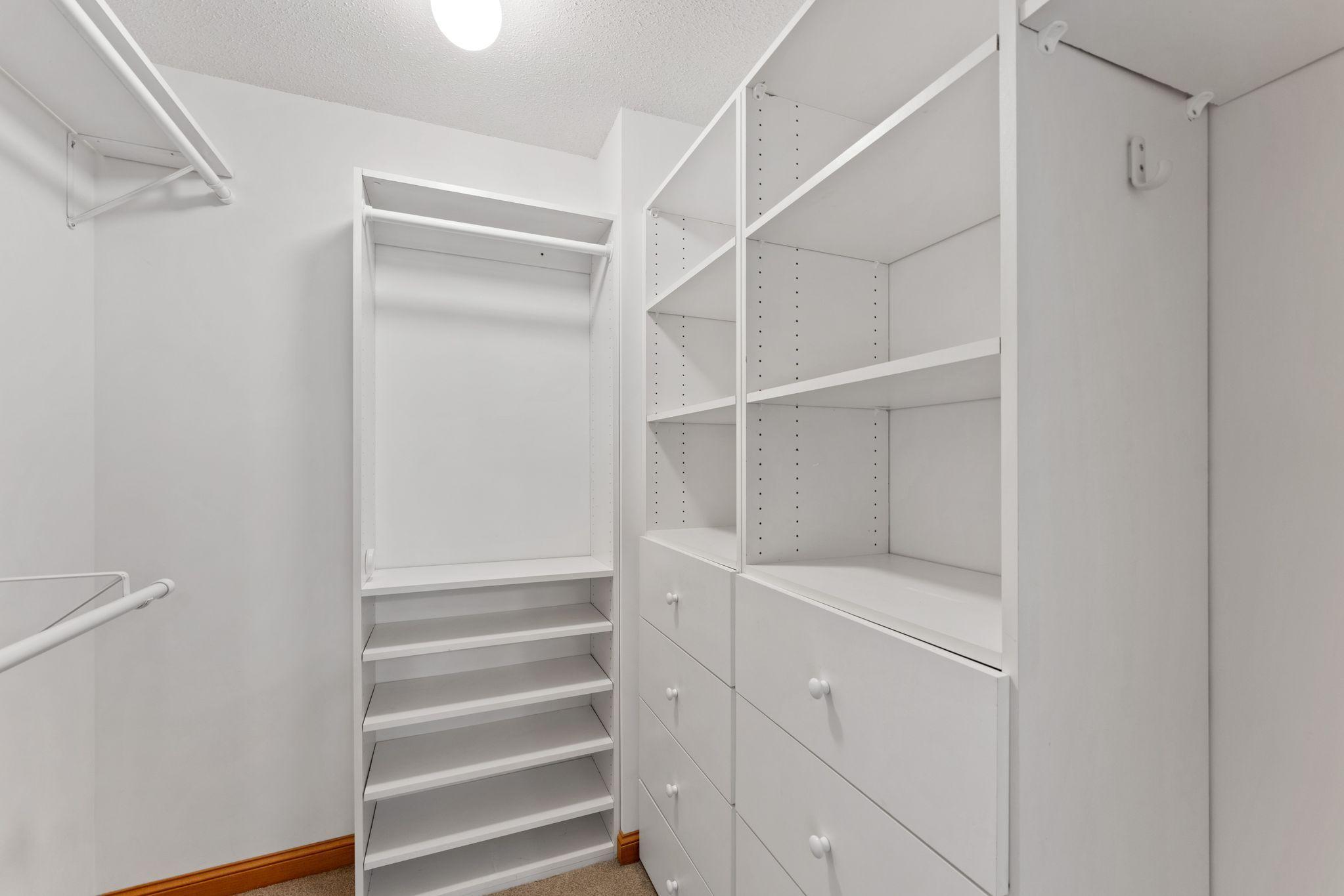 Primary bedroom -- walk-in closet with closet system!