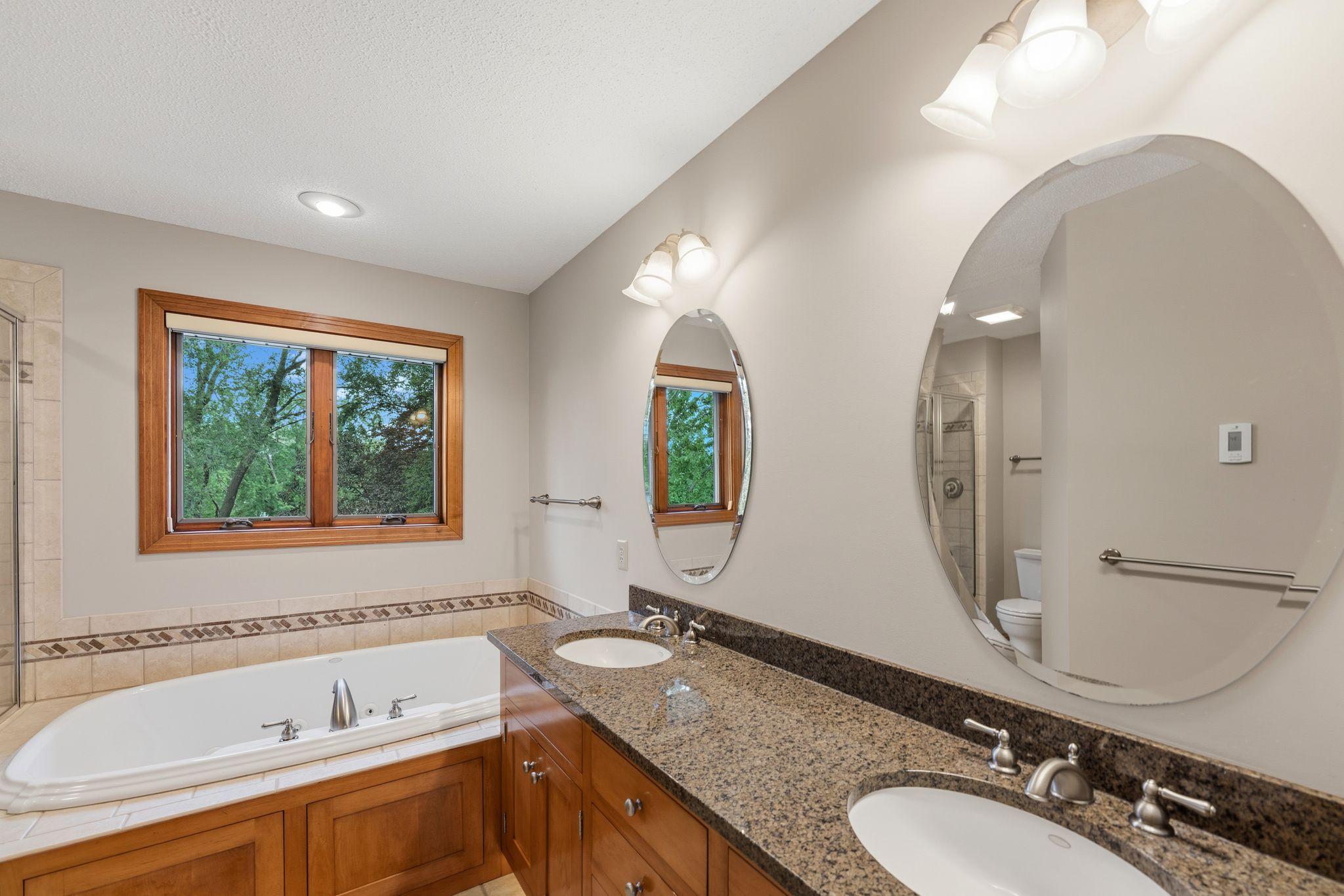 Dual sinks, updated granite countertops, heated floors, beautiful cherry cabinetry!