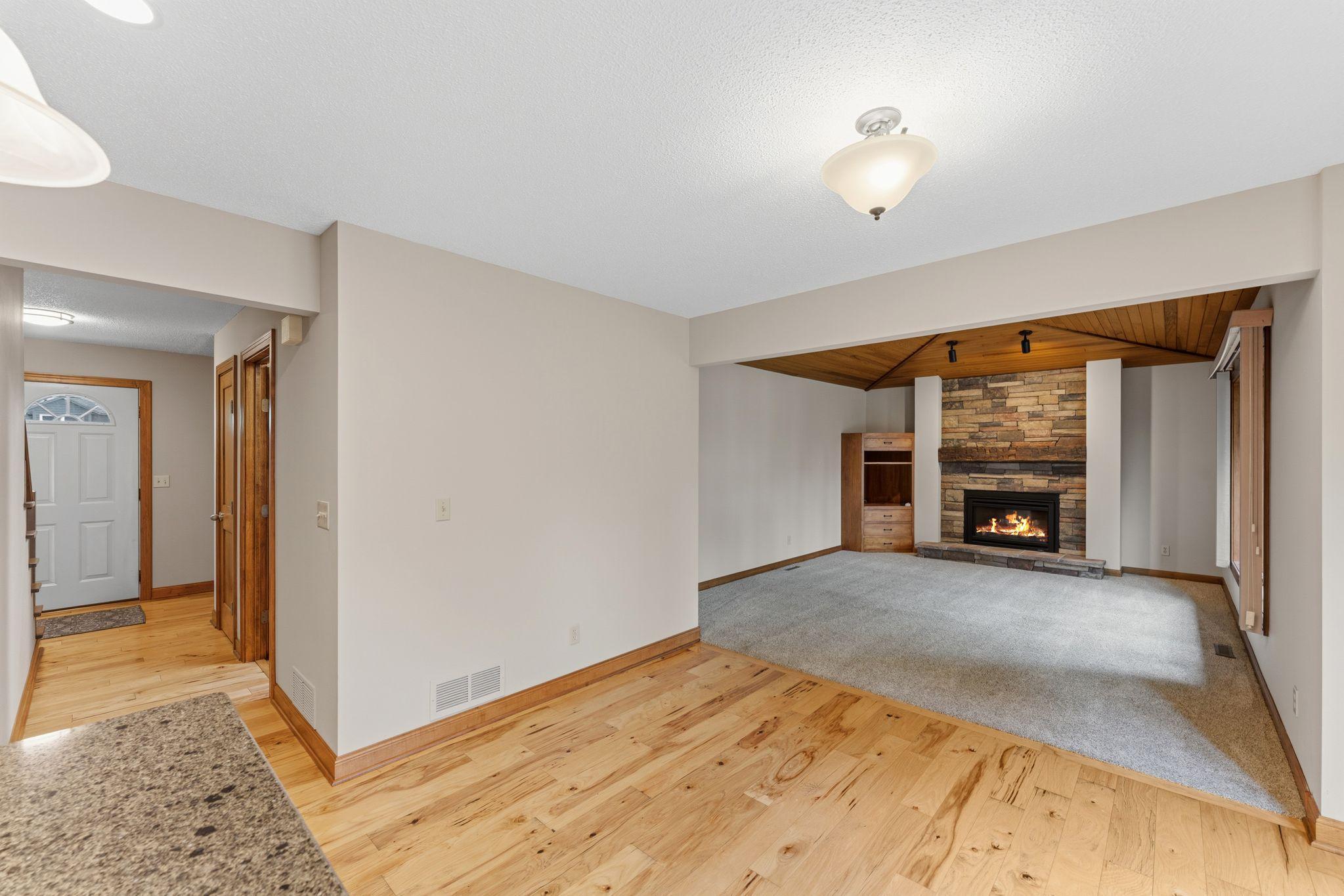 Main floor family room blends perfectly with the informal dining -- and you can keep an eye on the front door from the kitchen island.
