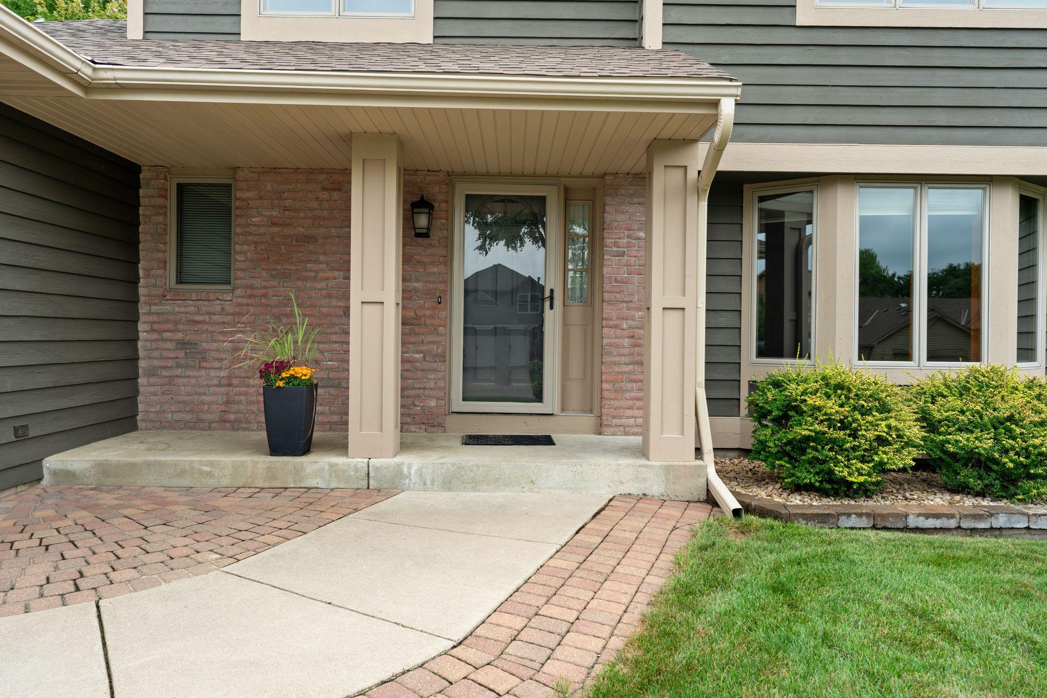 Welcoming front porch with paver patio!