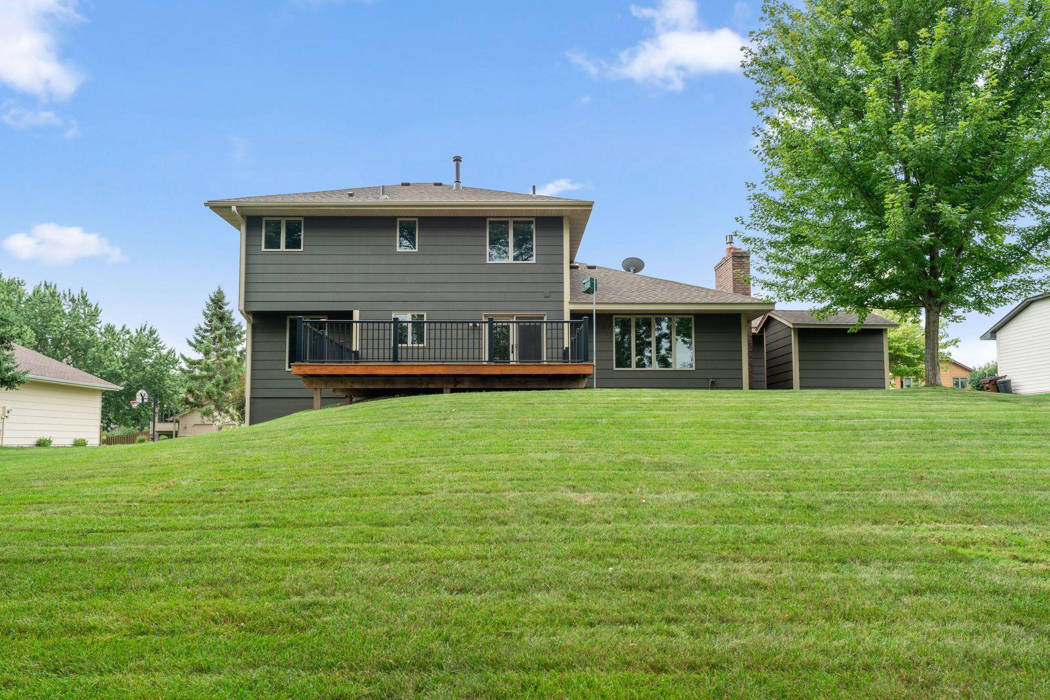 Wonderful backyard -- lush-green lawn, beautiful landscaping + irrigation system!!