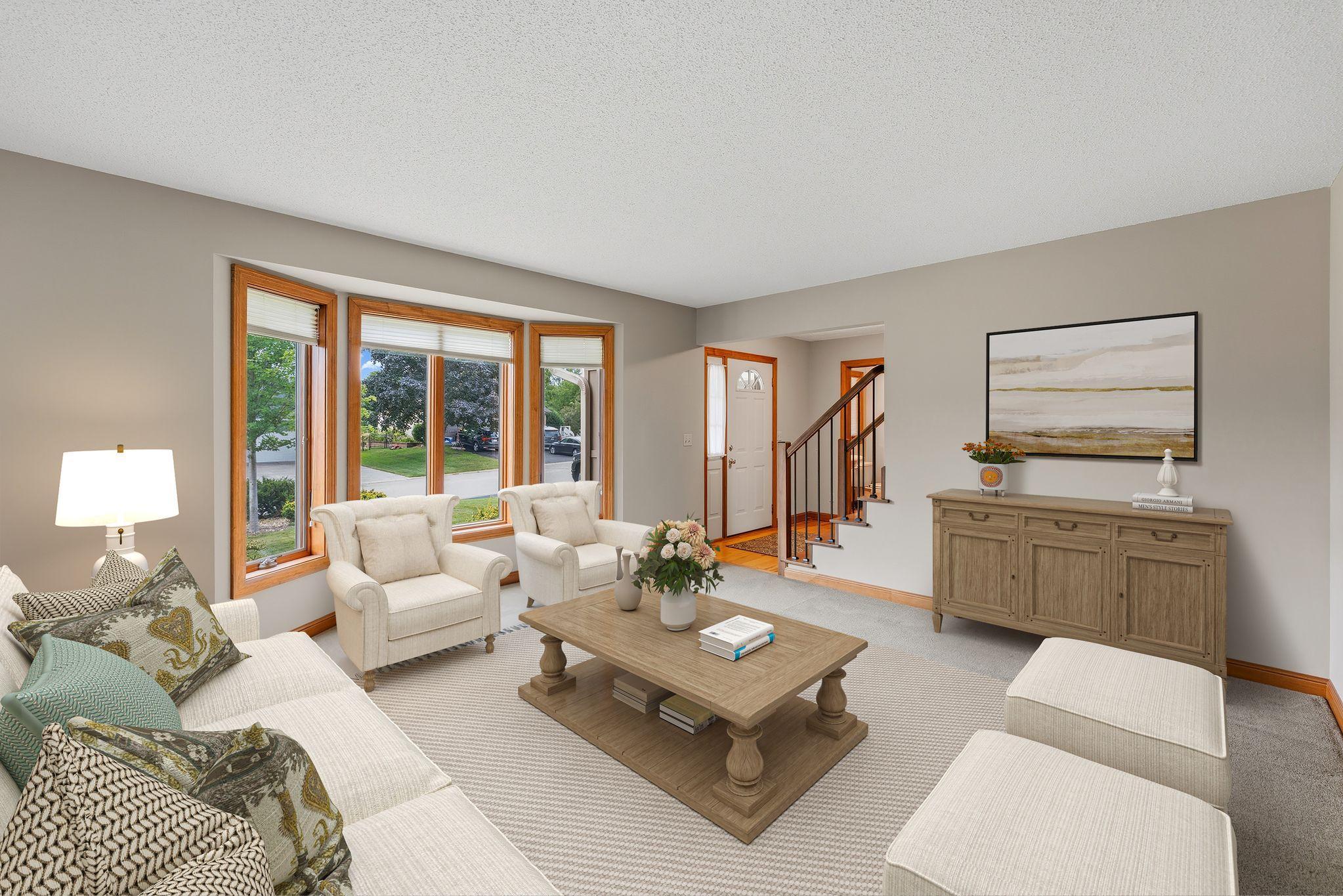 Just as you enter the home, the main floor living room makes a statement! Watch the world from your front windows - grab your favorite book and bask in the southern-sun that pours in!!! *Virtually Staged*