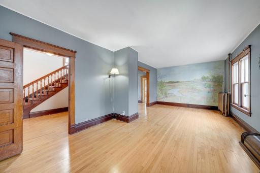 Living room with beautiful hand painted mural.jpg