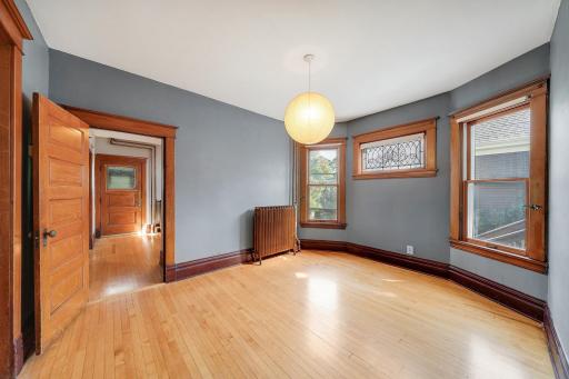 Dining area with doorway to front entry and beautiful woodwork.jpg