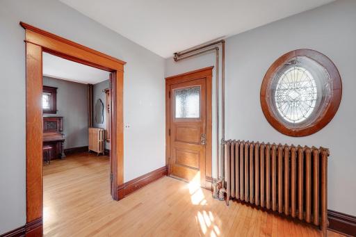 Spacious entry wth more artistic historic windows.jpg