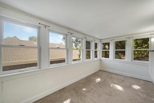 Second floor rear porch filled with windows.jpg