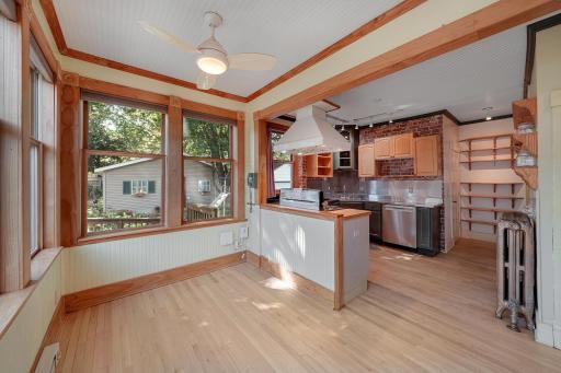 Well designed kitchen incorporating informal dining and lots of open shelving.jpg