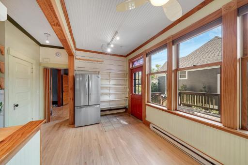 Kitchen with converted porch to informal dining.jpg