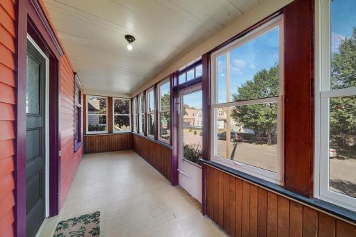 Front porch is a great buffer to winter cold or open it for a cool summer breeze.jpg
