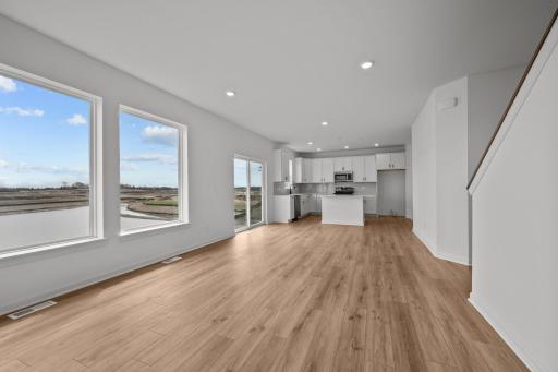Spacious family room in the McBee plan designed for everyday comfort and connection. Images are from a similar home, interior selections may differ