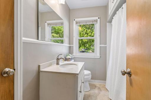 Full bathroom on the main level, freshly painted, with the added convenience of a bathroom/linen closet for additional storage.