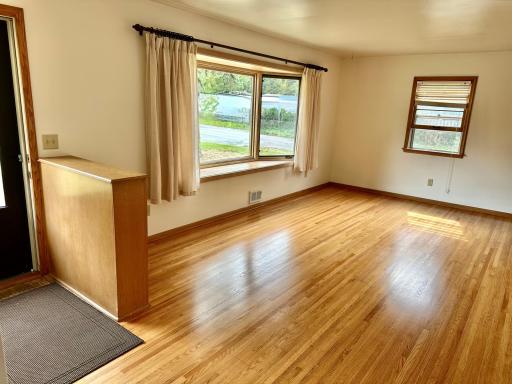 Bright Livingroom with Bay window and freshly refinished hardwood floors