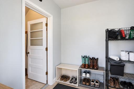 A convenient mudroom connects the over-sized garage to the home, offering the perfect drop zone for coats, shoes, and everyday essentials.