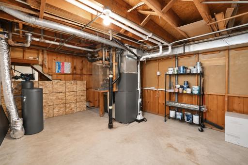 Clean and spacious utility room in the basement - perfect for storage.