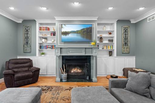 The main level family room with built in cabinets and a second main floor fireplace.