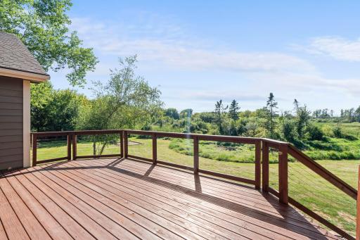 This is the deck off the dining room. It looks out into the backyard and the woods behind the house.