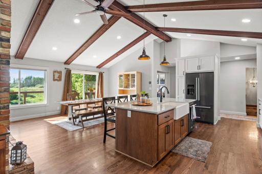 This shows the kitchen/dining from the family room .